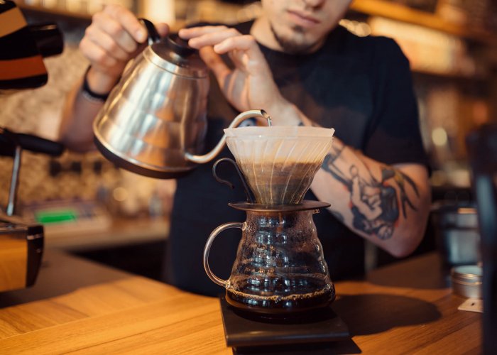 a barista serving Brasilmoka coffee