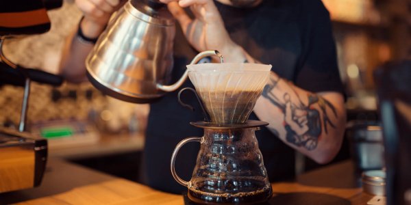 a barista serving Brasilmoka coffee